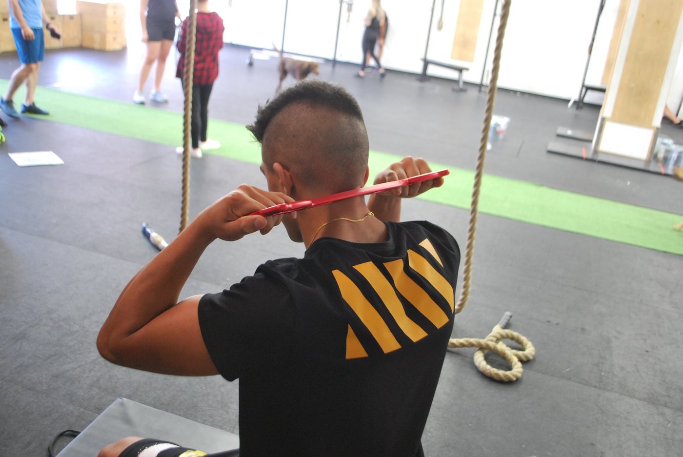 Athlete in the gym with the tool
